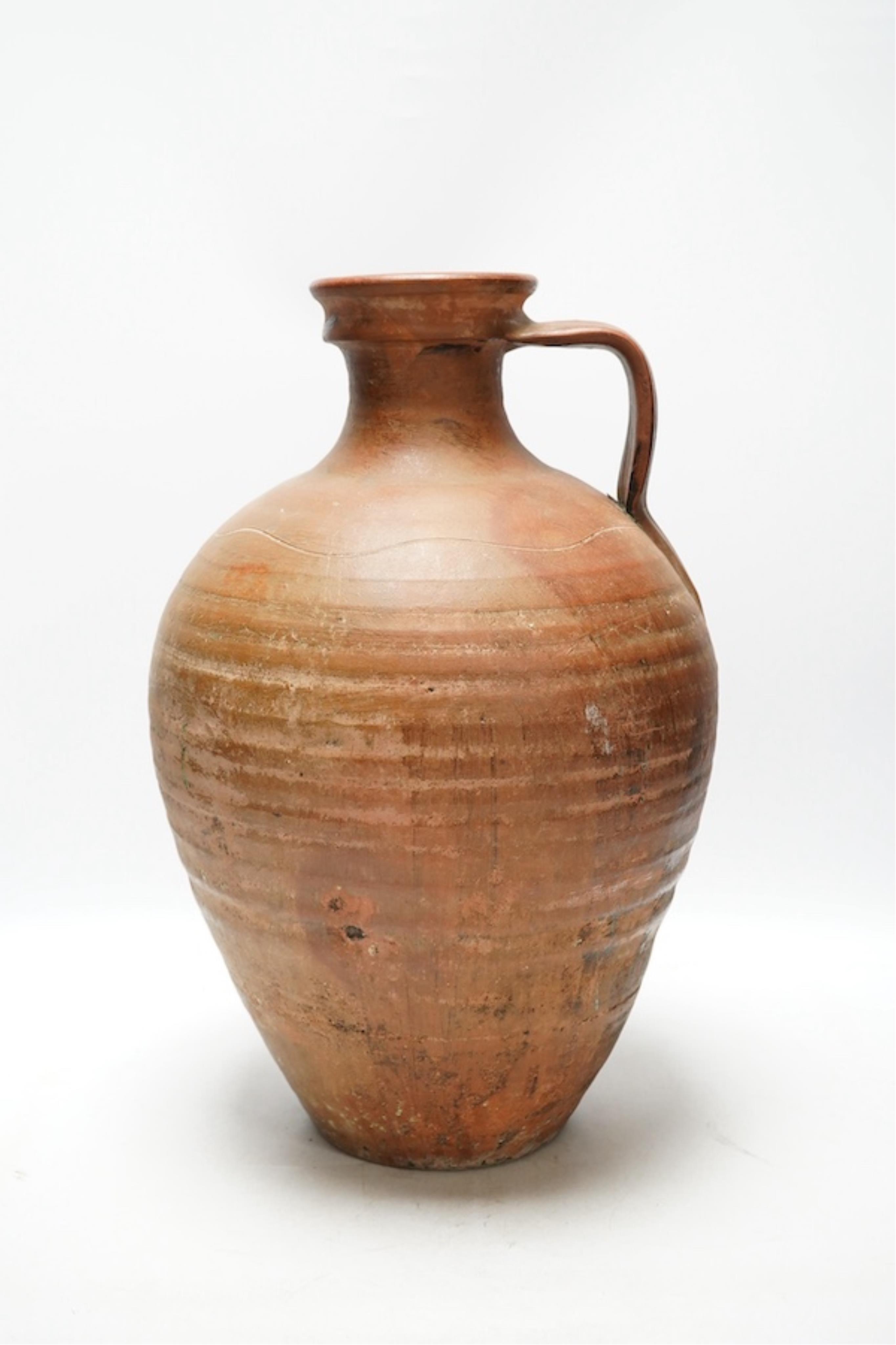 An 18th century Spanish terracotta wine vessel, 42cm. Condition - good